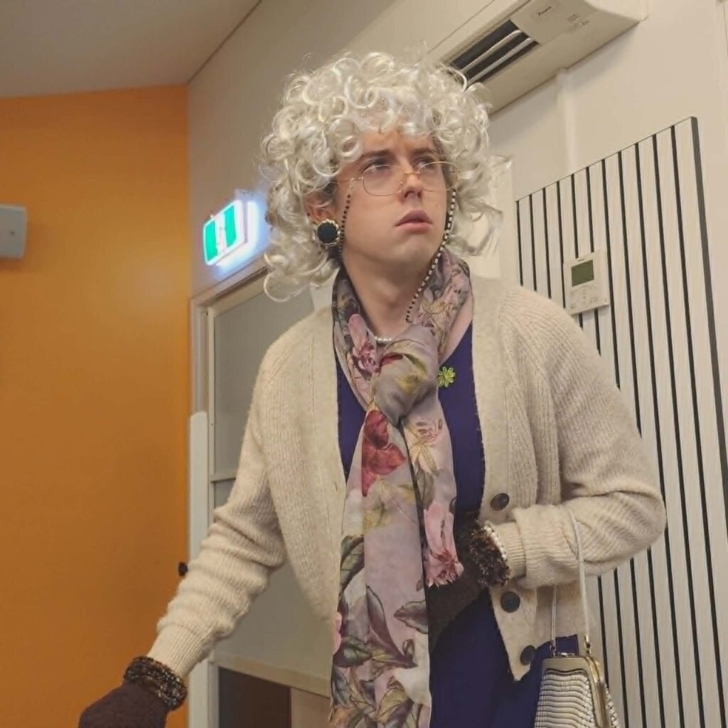 Detective Fanny Fox-Hunt. played by Will Collits, inspects different areas of the library