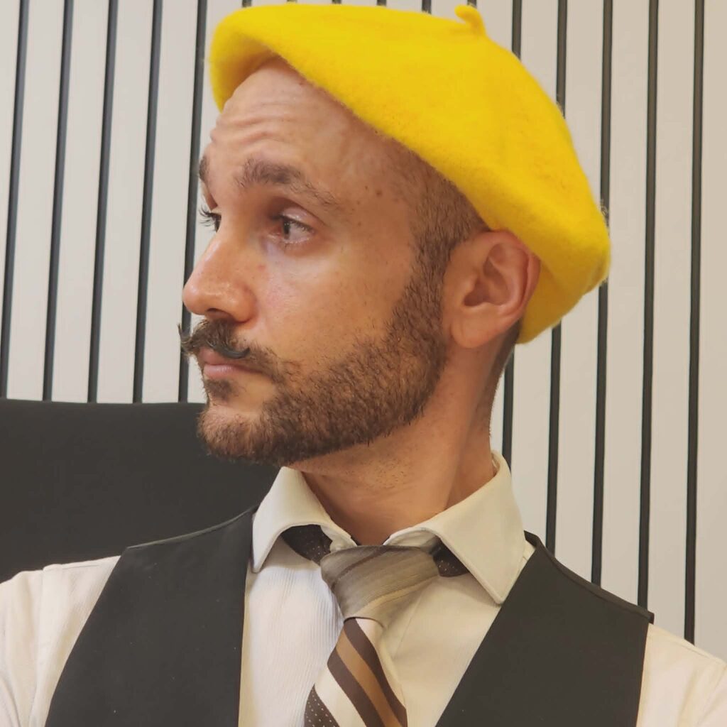 Sebastian Dimech is smartly dressed with a yellow beret,